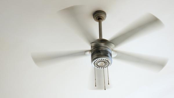 Closeup of a ceiling fan spinning in motion