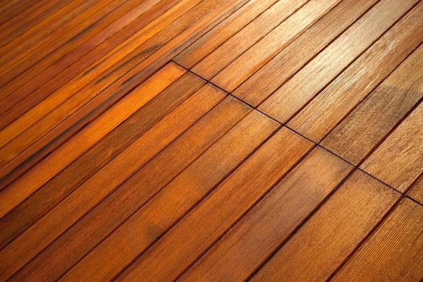Closeup of planked hardwood flooring.
