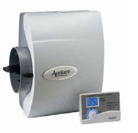 Aprilaire bypass humidifier with its control panel leaning against, showing 35% relative humidity.